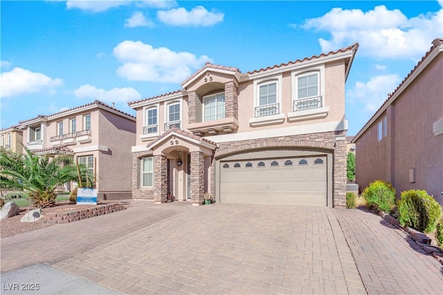 mediterranean / spanish-style house featuring a garage