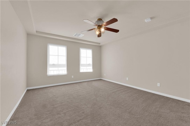 unfurnished room with ceiling fan and carpet