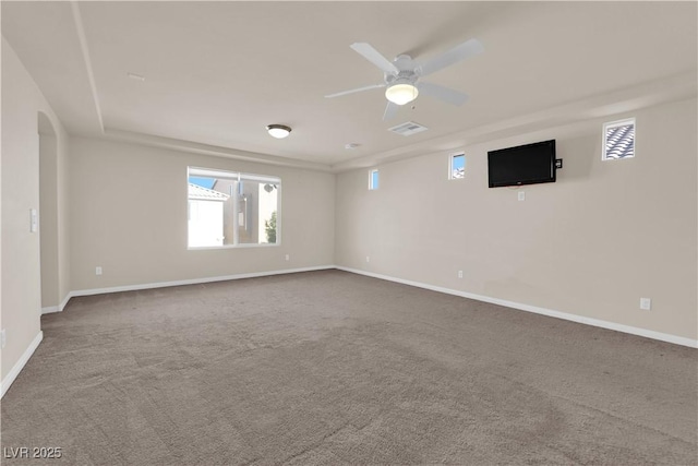 carpeted spare room with ceiling fan