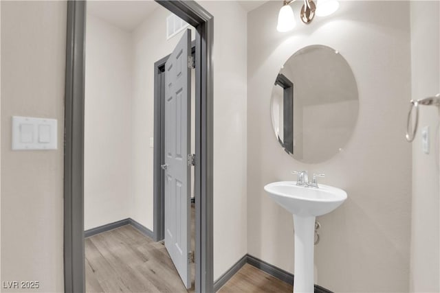 bathroom featuring hardwood / wood-style flooring and sink