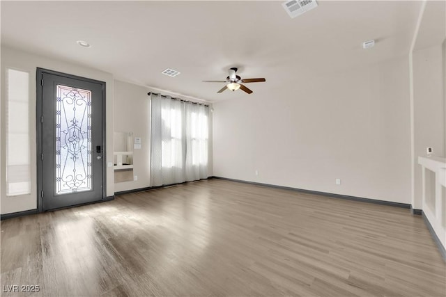 entrance foyer featuring light hardwood / wood-style flooring and ceiling fan