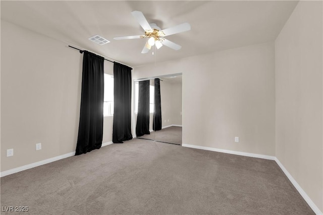 unfurnished room featuring carpet flooring and ceiling fan