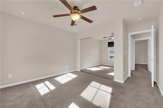 unfurnished bedroom with light colored carpet, a closet, and ceiling fan