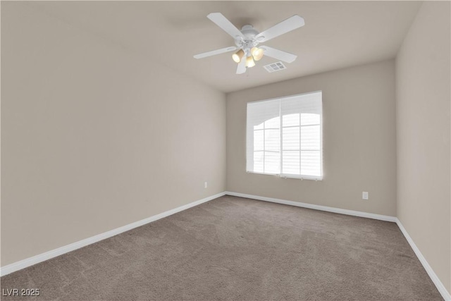 empty room featuring carpet floors and ceiling fan