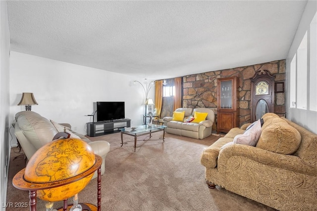 carpeted living room featuring a textured ceiling