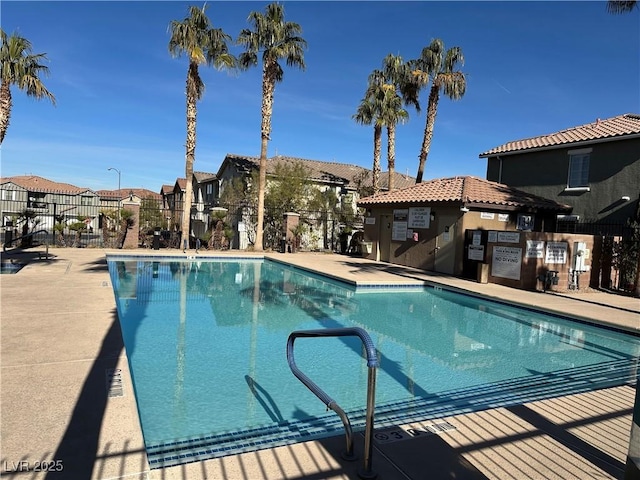 view of swimming pool featuring a patio area