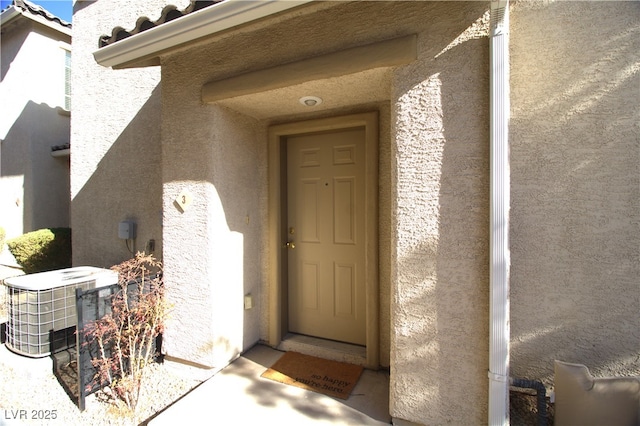 property entrance with central air condition unit