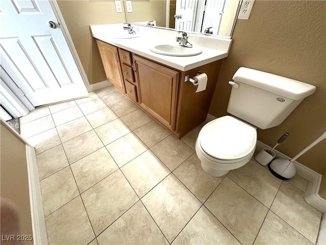 bathroom featuring tile patterned floors, toilet, and vanity