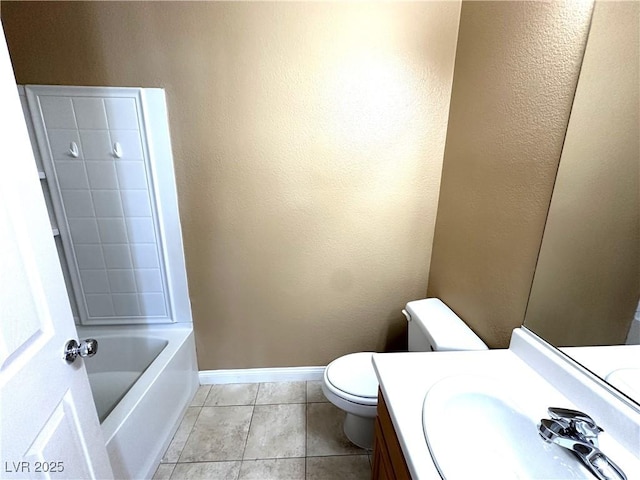 bathroom featuring toilet, tile patterned flooring, a bath, and vanity