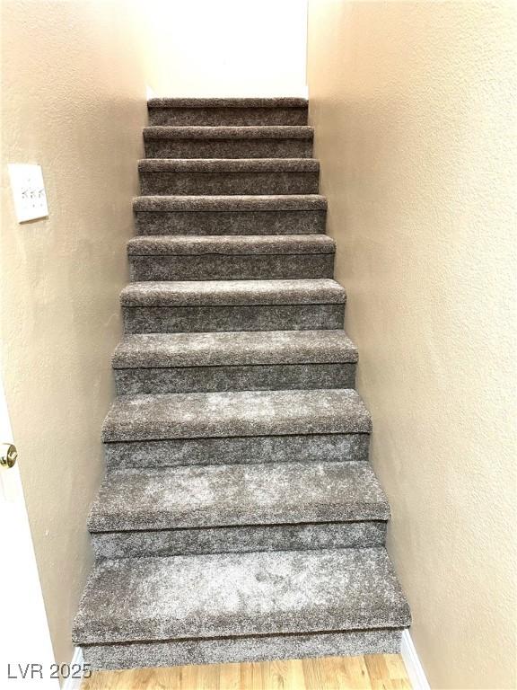 stairway with wood-type flooring