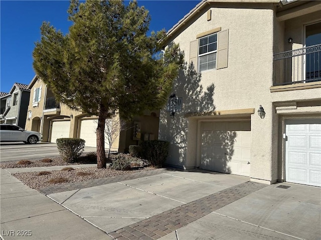 townhome / multi-family property featuring a garage