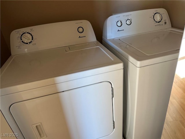 clothes washing area featuring washing machine and clothes dryer