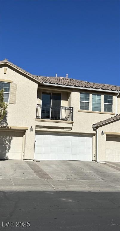 view of front of house with a balcony and a garage