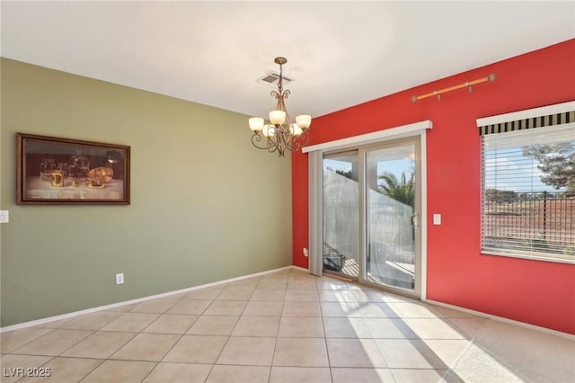 unfurnished dining area with light tile patterned floors and a chandelier