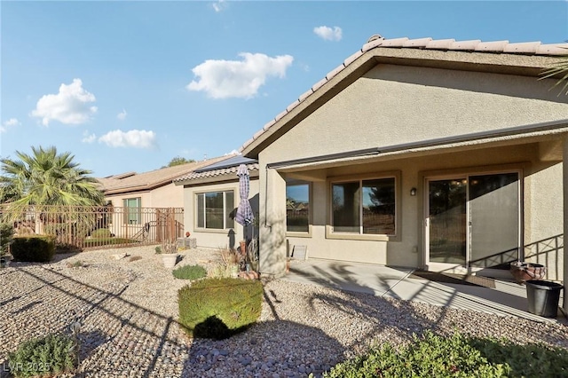 rear view of house with a patio area