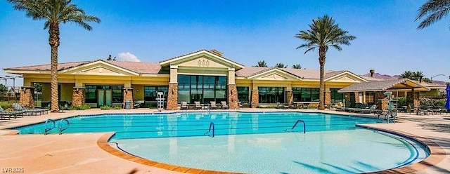 view of pool featuring a patio