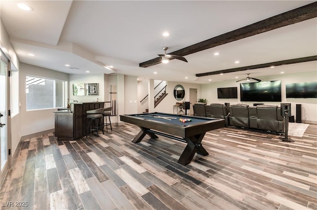 rec room featuring beam ceiling, recessed lighting, wood finished floors, wet bar, and billiards