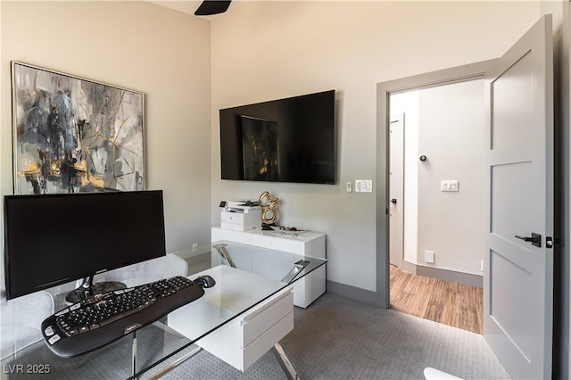 office area featuring baseboards and wood finished floors