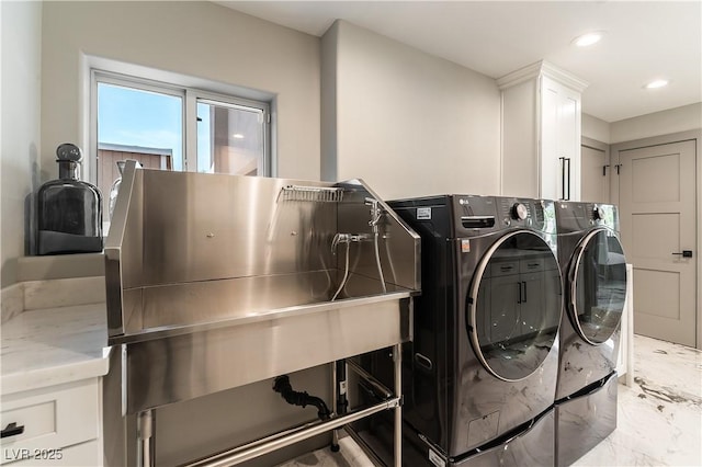 laundry room with recessed lighting, marble finish floor, cabinet space, and washer and clothes dryer