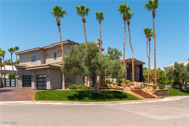 mediterranean / spanish-style home featuring a garage