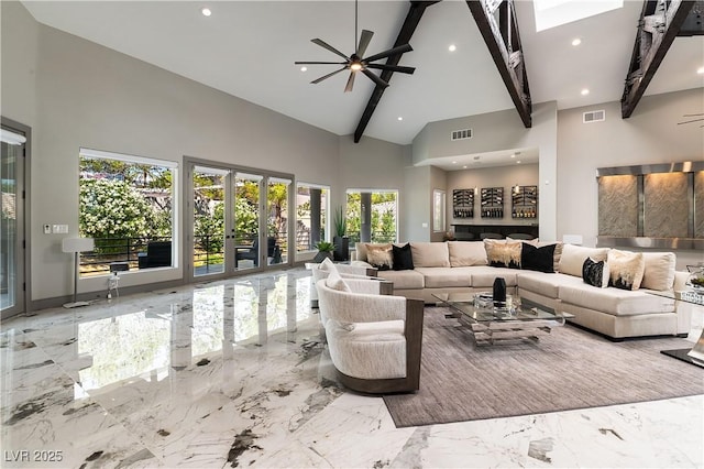 living room featuring a ceiling fan, recessed lighting, marble finish floor, high vaulted ceiling, and beamed ceiling