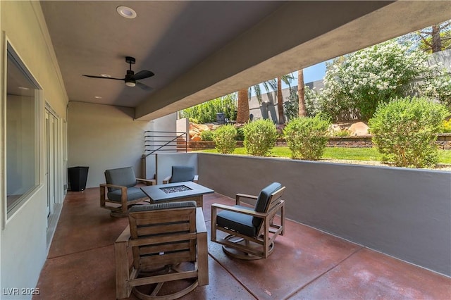 view of patio featuring a fire pit and a ceiling fan