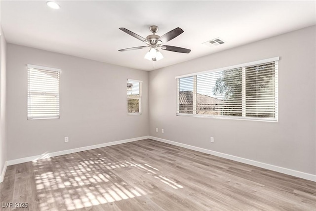 unfurnished room featuring ceiling fan and light hardwood / wood-style flooring