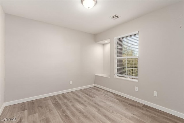 unfurnished room featuring light wood-type flooring