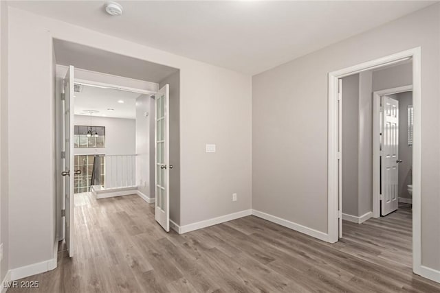 hallway with wood-type flooring