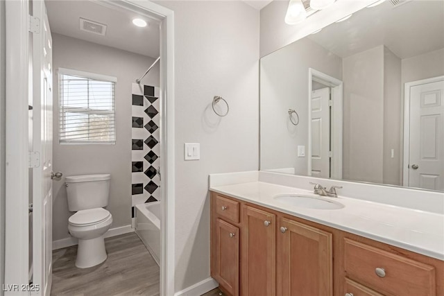 full bathroom featuring shower / bathtub combination with curtain, vanity, wood-type flooring, and toilet