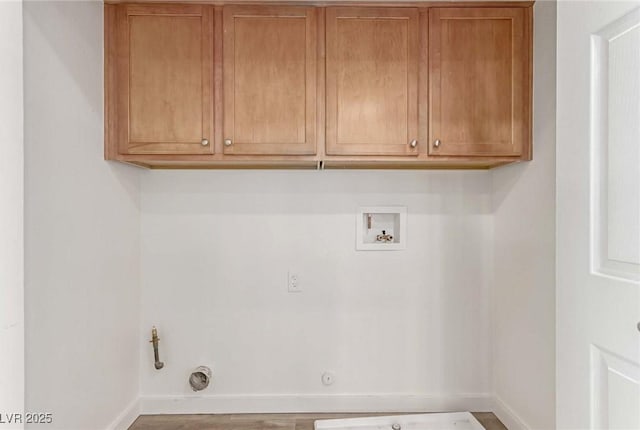 laundry area with hookup for a gas dryer, cabinets, and washer hookup