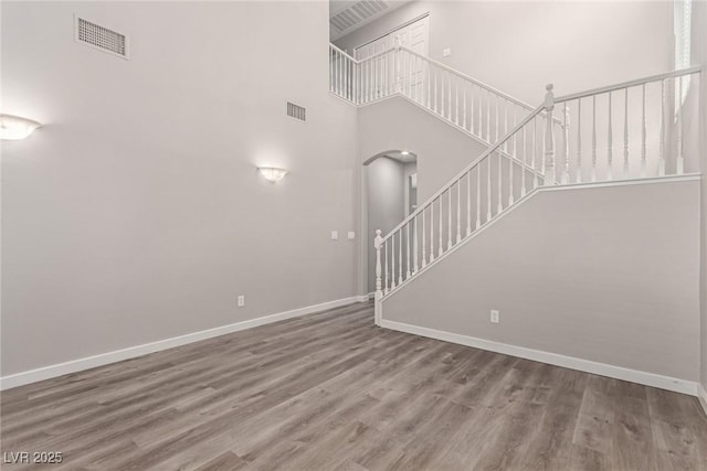 unfurnished living room featuring hardwood / wood-style flooring