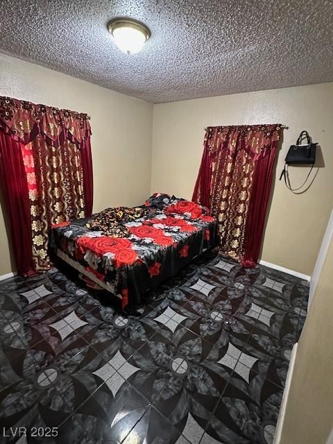 bedroom featuring a textured ceiling