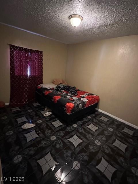 unfurnished bedroom featuring a textured ceiling