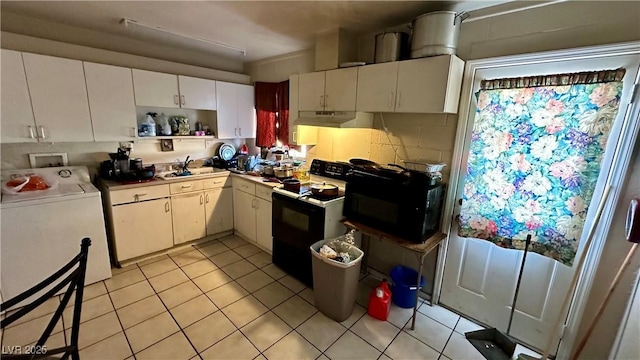 kitchen featuring washer / dryer, sink, white cabinetry, electric range oven, and light tile patterned floors