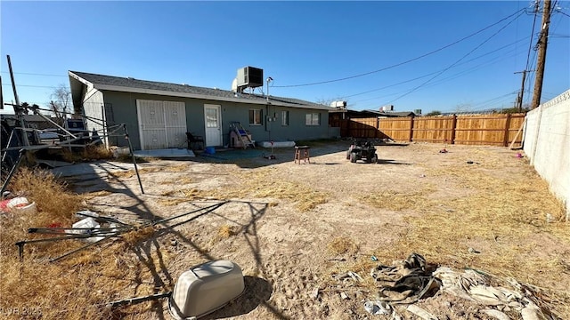 rear view of house with cooling unit