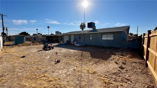 rear view of property featuring cooling unit