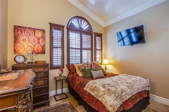 bedroom with crown molding and lofted ceiling