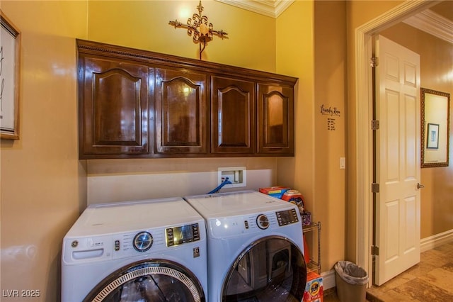 laundry room with cabinets, washer and clothes dryer, and ornamental molding