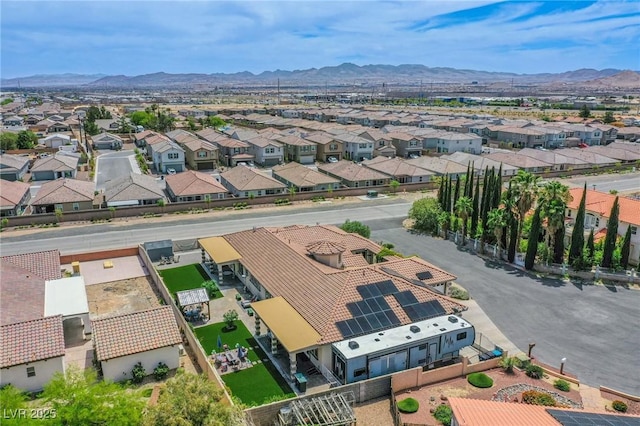 birds eye view of property with a mountain view