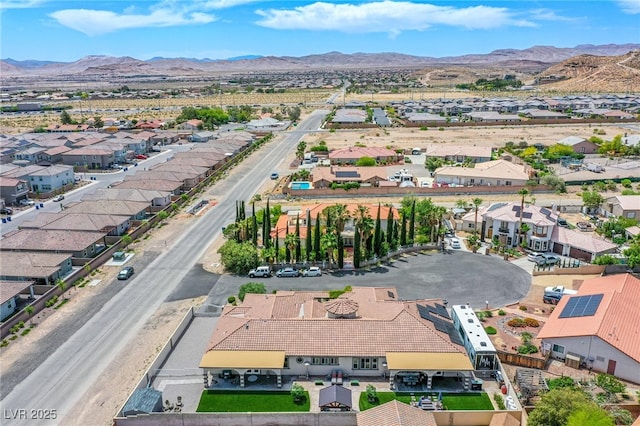 birds eye view of property featuring a mountain view