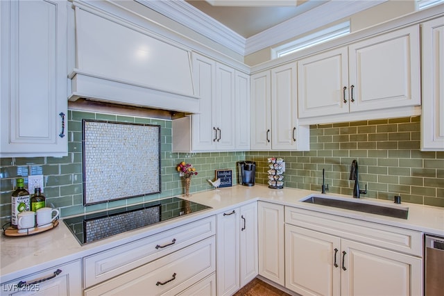 kitchen with sink, white cabinets, and decorative backsplash