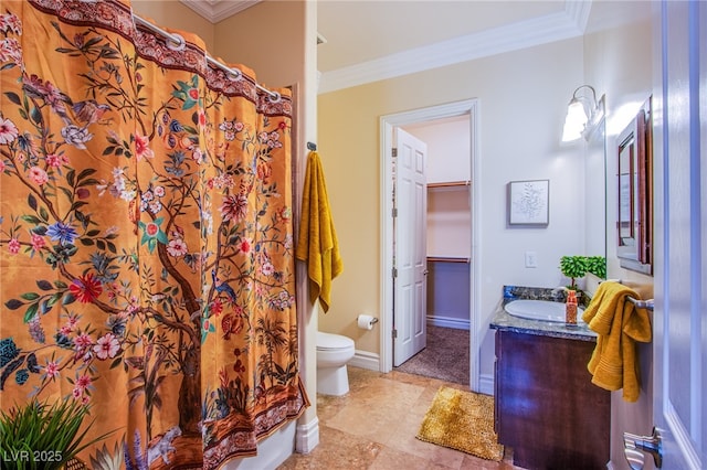 bathroom featuring vanity, toilet, and ornamental molding