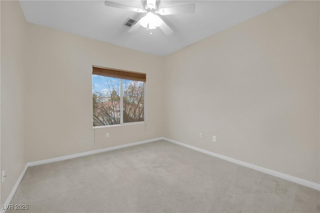 empty room featuring light carpet and ceiling fan