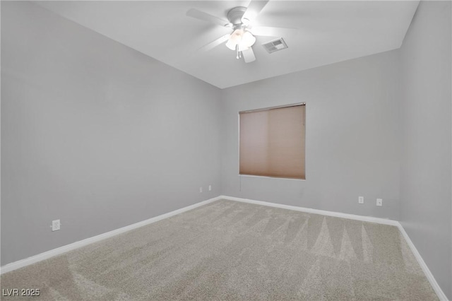 empty room featuring carpet flooring and ceiling fan