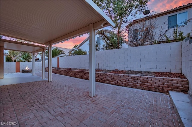 view of patio terrace at dusk