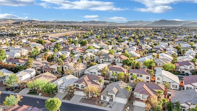 birds eye view of property featuring a mountain view