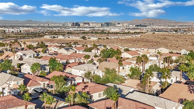 birds eye view of property with a mountain view