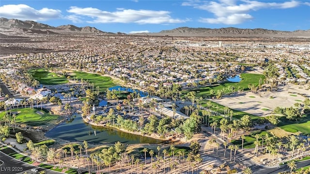 birds eye view of property featuring a water and mountain view