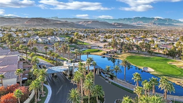 bird's eye view with a water and mountain view